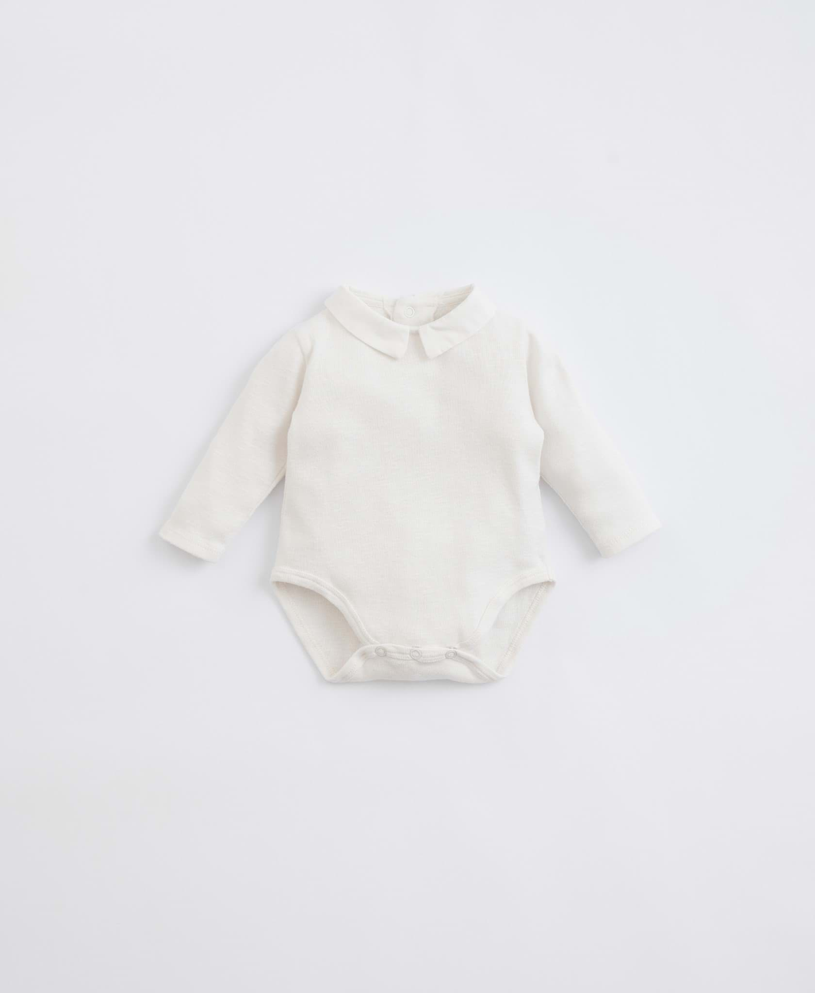 صورة white baby body suit
