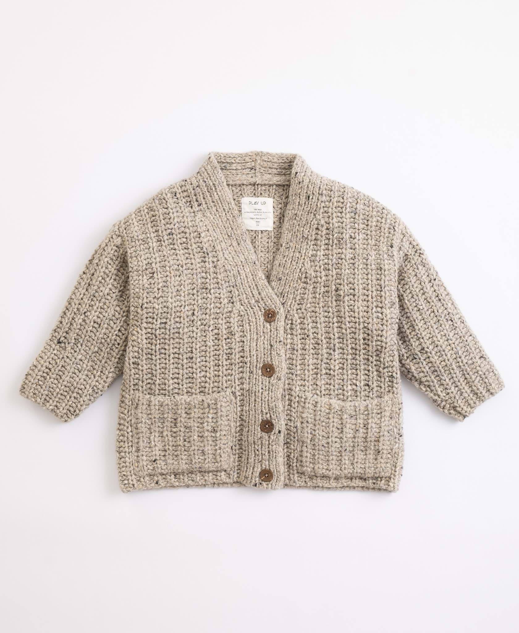 صورة Knitted jacket with pockets | Illustration
